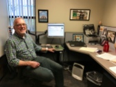 Gerald Brown sits at his desk at the Utah Refugee Education & Training Center.